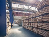 A coffee warehouse from inside. Bags are stored left and right.