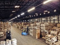 The warehouse in Bury St Edmunds from inside with coffee bags on pallets and a forklift