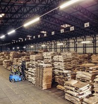The warehouse in Bury St Edmunds from inside with coffee bags on pallets and a forklift