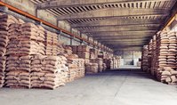 A coffee warehouse from inside. Bags are stapled left and right.